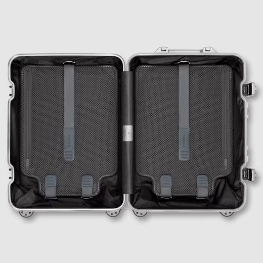 Open suitcase interior showing the height adjustable Flex Divider