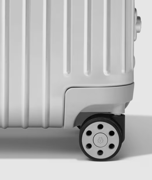 Detail of the RIMOWA Multiwheel System wheel on the suitcase shell